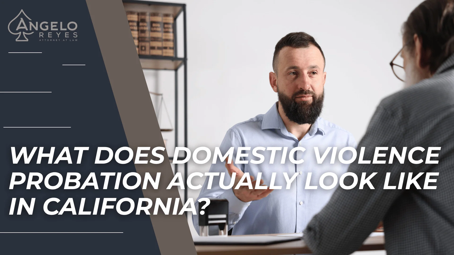 Attorney consulting with client across desk while introducing California domestic violence probation requirements.